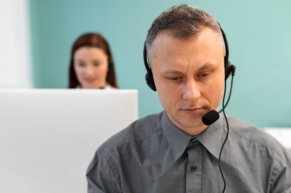 Man working call center with headphones computer